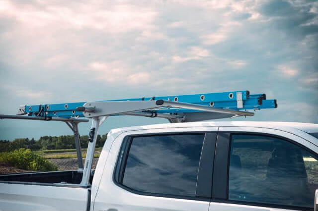 blue ladder on over-cab utility rack